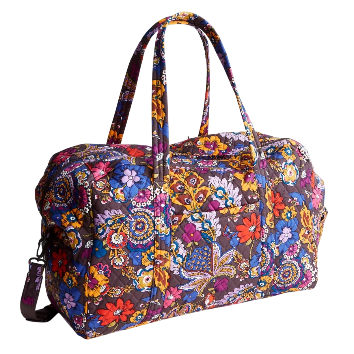 A colorful, quilted duffel bag featuring a vibrant floral pattern with long handles and an adjustable shoulder strap.