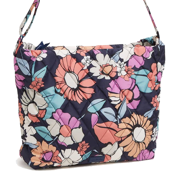A colorful quilted shoulder bag with a floral pattern featuring large flowers in pink, orange, blue, and white on a dark background.