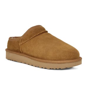 This is a suede slip-on slipper featuring a wide over-foot strap and a sturdy, treaded rubber sole.