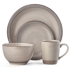 A four-piece stoneware dinnerware set featuring a bowl, mug, dinner plate, and salad plate, each with a textured beige finish and subtle speckled design.
