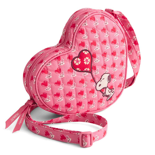 Heart-shaped pink crossbody bag featuring Snoopy and red heart patterns, complete with an adjustable strap and zipper closure.