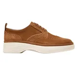 Brown suede wingtip Oxford shoe with perforated detailing and a thick, white grooved sole.