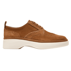 Brown suede wingtip Oxford shoe with perforated detailing and a thick, white grooved sole.