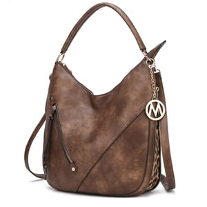 A brown faux leather hobo bag with a decorative metal logo charm and a patterned strap detail.