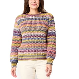 Colorful striped knit sweater with a textured pattern, worn with light-colored pants.