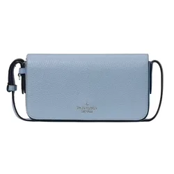 A light blue Kate Spade crossbody bag with a pebbled leather texture, featuring a compact design and a simple strap.