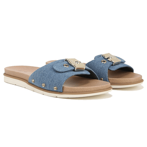 Blue denim slide sandals with beige soles, featuring gold-tone hardware and small stud accents.