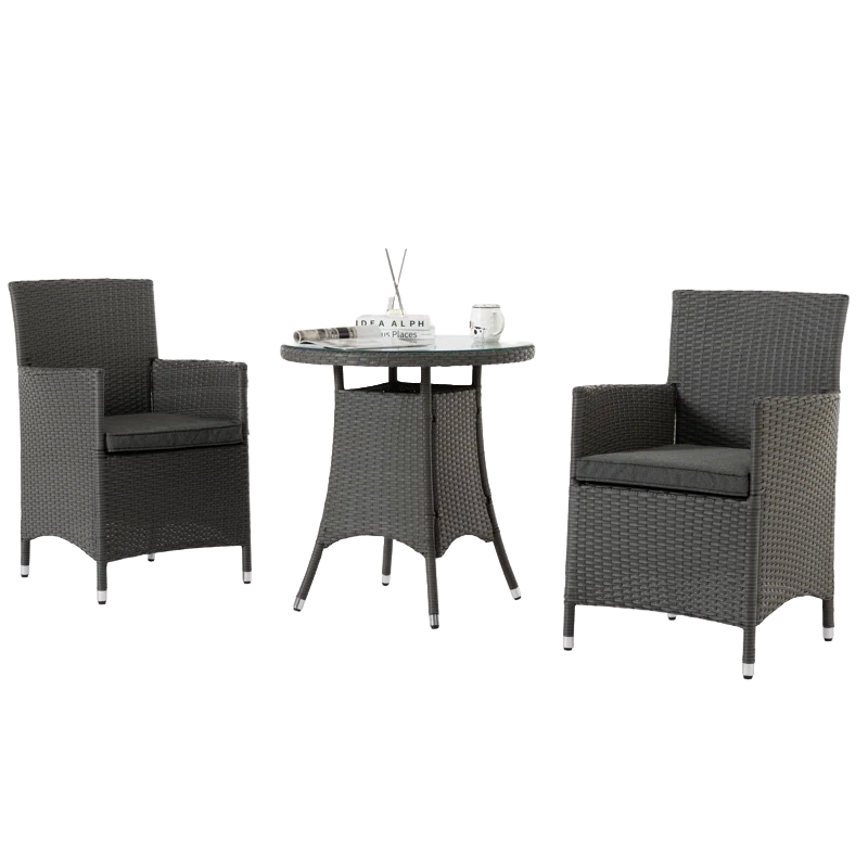 3-piece outdoor dining set includes two dark gray rattan armchairs with gray cushions and a round glass-top table. Perfect for small patio or garden spaces.