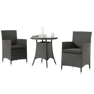 3-piece outdoor dining set includes two dark gray rattan armchairs with gray cushions and a round glass-top table. Perfect for small patio or garden spaces.