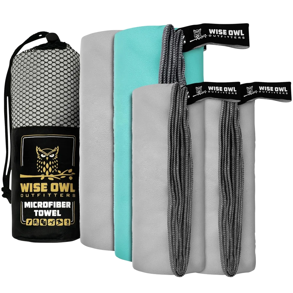 Set of Wise Owl Outfitters microfiber towels in gray and teal, featuring hanging loops and embroidered tags, accompanied by a breathable mesh carrying pouch.