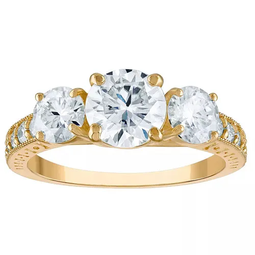 Gold ring featuring three large round diamonds with a detailed band.