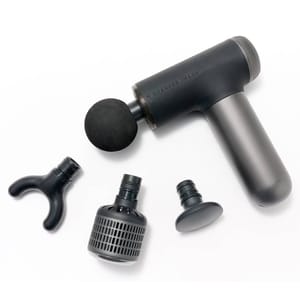The Sharper Image Percussion Massager is a handheld device with multiple interchangeable attachment heads, designed for targeted muscle relaxation and relief.