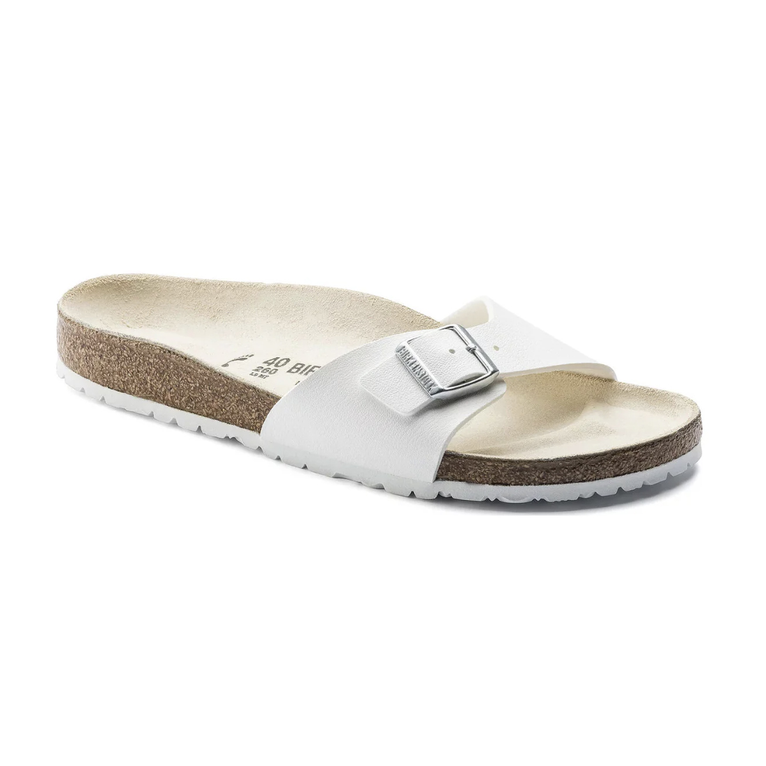 A white slide sandal with a cork footbed and a single adjustable buckle strap.