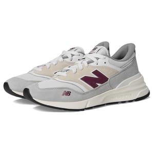 New Balance sneakers feature a blend of gray, beige, and maroon colors with a prominent \“N\“ logo on the side, cushioned midsole, and black outsole.