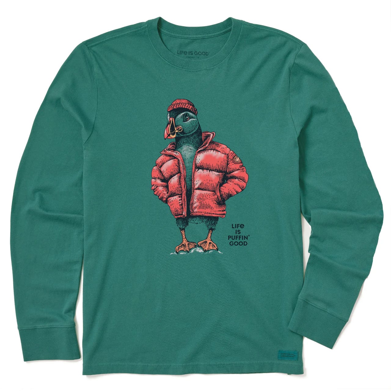 Green long sleeve tee featuring a puffin wearing a red puffer jacket and beanie, with the text \“Life is Puffin’ Good\“ printed beneath the graphic.