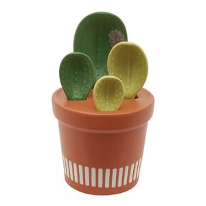 A cactus-themed flower pot set with four cactus-shaped utensils in a terracotta-style pot.