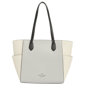 A Kate Spade New York tote bag with a two-tone design of light gray and cream, featuring black handles and embossed branding on the front.
