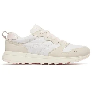A stylish sneaker with a beige and white color scheme, featuring a textured floral pattern on the sides and suede accents.