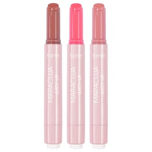 A set of three Tarte Maracuja Juicy Lip Balms in pink twist-up tubes, featuring shades of brown, bright pink, and mauve. The packaging is sleek and labeled with the brand and product name.