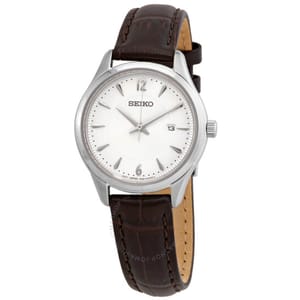 Seiko wristwatch with a silver dial, silver hands, and indices, featuring a date display at the 3 o'clock position. It has a brown leather strap.