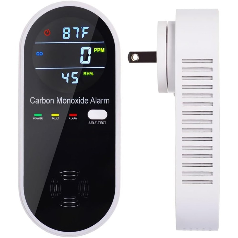 A digital carbon monoxide alarm displays temperature, CO levels in PPM, and relative humidity. The device features power, fault, and alarm indicators, a self-test button, and side ventilation.