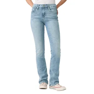 Light blue straight-leg jeans paired with white sneakers and a white top, with hands tucked in pockets.