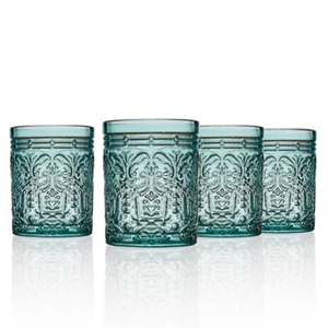 A set of four ornate, textured aqua-blue glass tumblers with intricate decorative patterns and a reflective base.