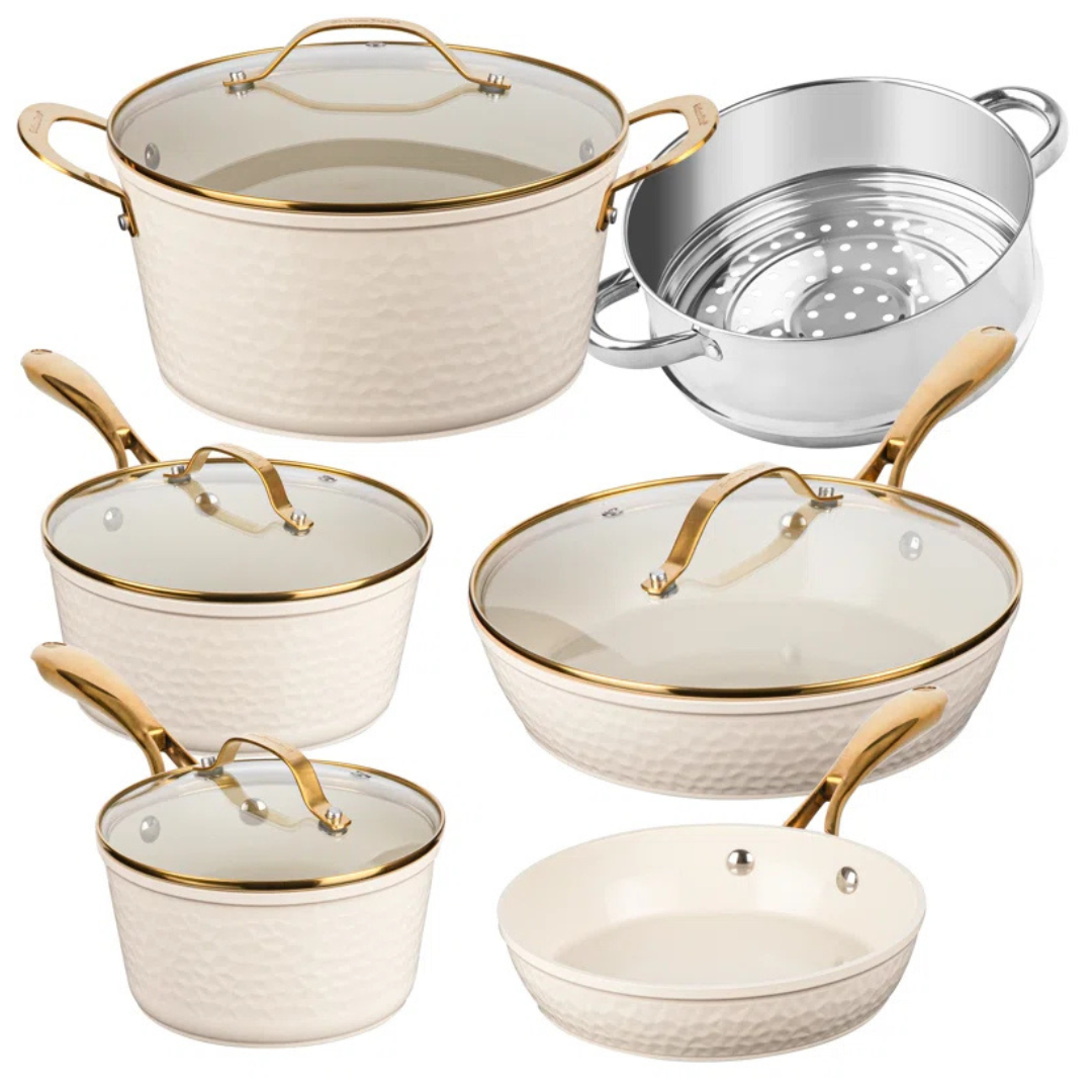 Gotham Steel 10-piece ceramic cookware set with hammered design and gold-tone handles includes two frying pans, saucepans with lids, a stockpot with lid, and a stainless steel steamer insert, all featuring glass lids and a non-stick ceramic surface in beige.