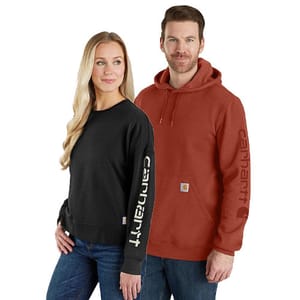 Two people wearing Carhartt clothing: one in a black long-sleeve shirt with \“Carhartt\“ on the sleeve, and the other in a rust-colored hooded sweatshirt with the same branding on the sleeve and a small logo patch.