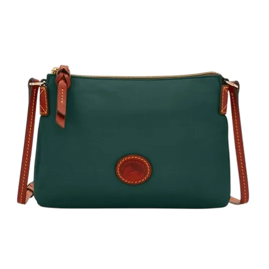 A green crossbody bag with brown leather accents and stitching, featuring a small oval patch with an embossed design, and a zippered top closure.