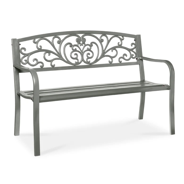 A gray metal bench with decorative scrollwork on the backrest and simple armrests.