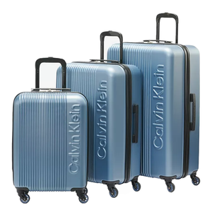 Set of three light blue Calvin Klein hardshell suitcases with black handles and 360-degree spinner wheels, featuring an embossed brand logo.