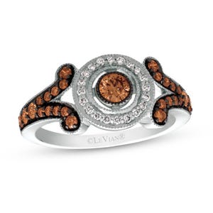 Le Vian 5/8ct Diamond Ring in 14K white gold features a central chocolate diamond surrounded by a double halo of white diamonds, with additional chocolate diamonds along the split shank, set on a contrasting metal background.