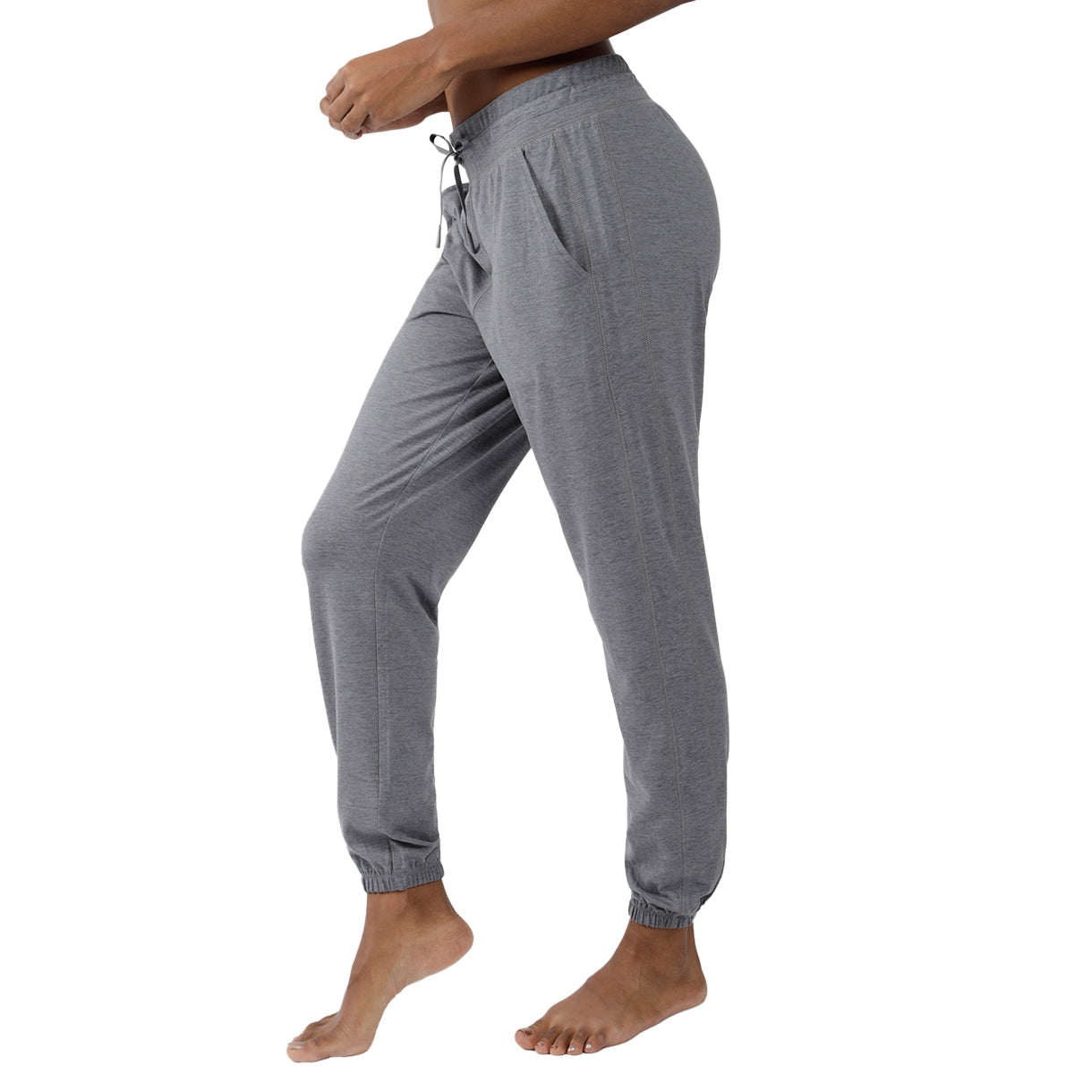Gray jogger pants with a drawstring waist and elastic ankle cuffs, shown from a side angle.