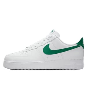 White sneaker with green accents, including a green swoosh logo on the side and green detailing on the heel.