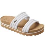 White slide sandal featuring three padded straps and a brown platform sole with a wavy tread design.