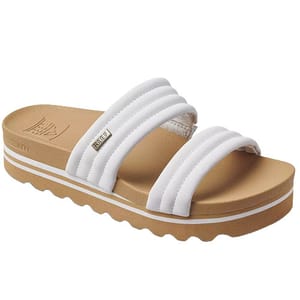 White slide sandal featuring three padded straps and a brown platform sole with a wavy tread design.