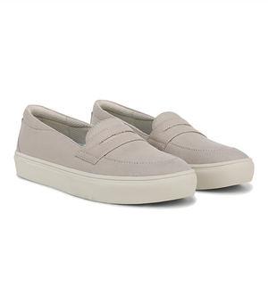 Beige slip-on shoes with a textured rubber sole and a simple, casual design.