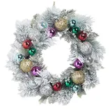 A decorative Christmas wreath featuring frosted pine branches, gold and silver glittery balls, and colorful ornaments in red, green, purple, and blue, accented with shimmering silver berries.