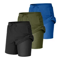 Three pairs of athletic shorts in black, green, and blue with built-in leggings and drawstring waists.