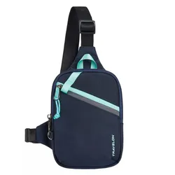 A navy and teal crossbody sling bag with an adjustable strap and front zippered pocket, featuring the brand name \“Travelon\“.