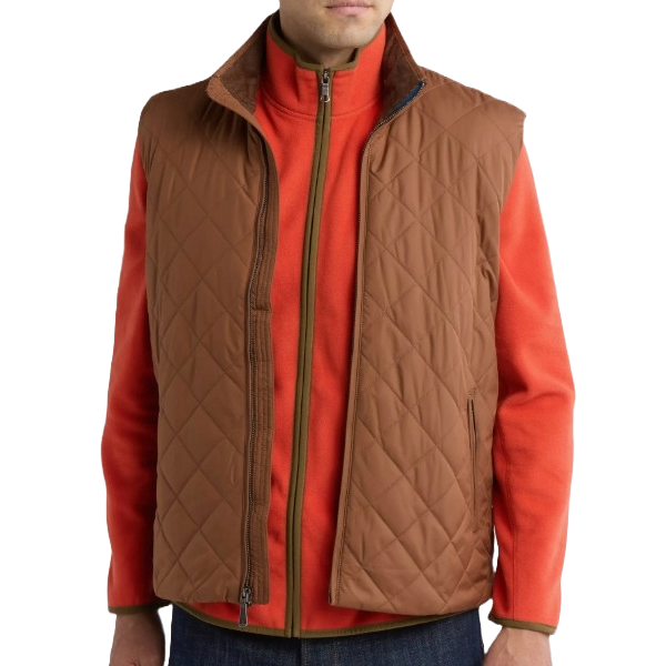 A brown Brooks Brothers quilted vest with a high collar, shown over an orange zip-up jacket with green trim, worn by a person in blue jeans.