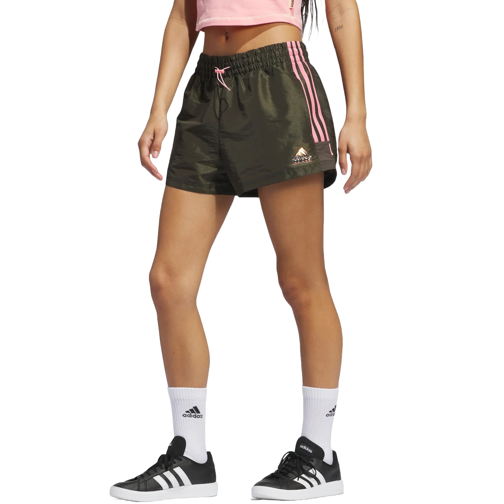 Adidas Lightweight Woven Shorts are dark green with pink stripes, featuring an elastic waistband and pink drawstring. They have a small triangular logo on the leg, perfect for casual and athletic wear.