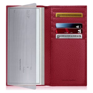 Red genuine leather checkbook cover with multiple card slots, holding several credit cards and checks.