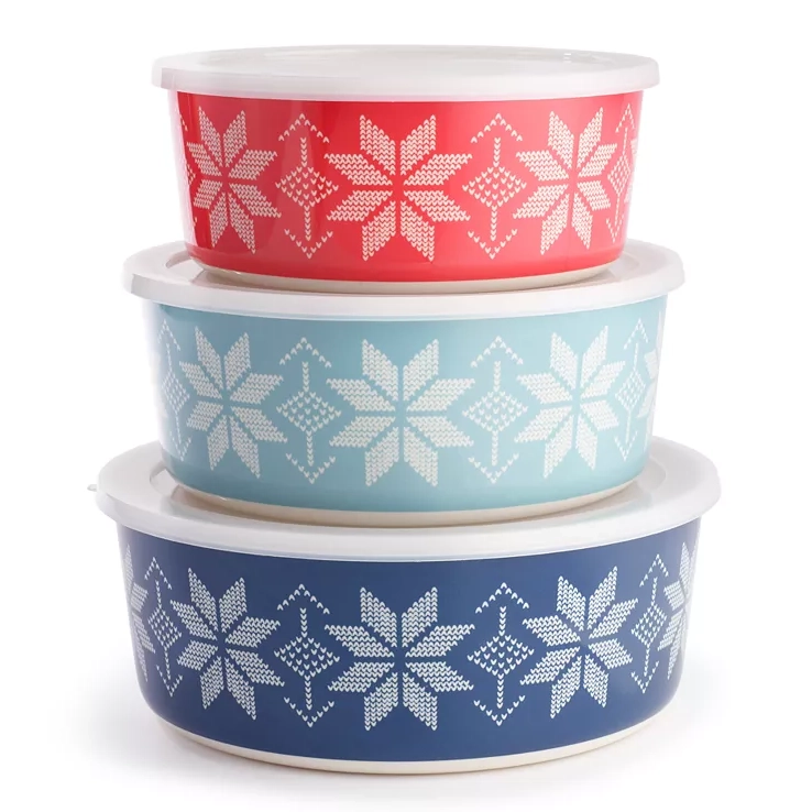 Three nested bowls with snowflake patterns in red, teal, and navy colors.