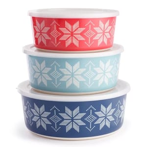 Three nested bowls with snowflake patterns in red, teal, and navy colors.