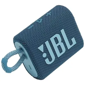 A compact, blue JBL portable Bluetooth speaker with a fabric cover and an integrated carrying loop, designed for on-the-go audio.