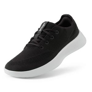 Black and white lightweight running shoes with breathable knit upper and cushioned white sole.