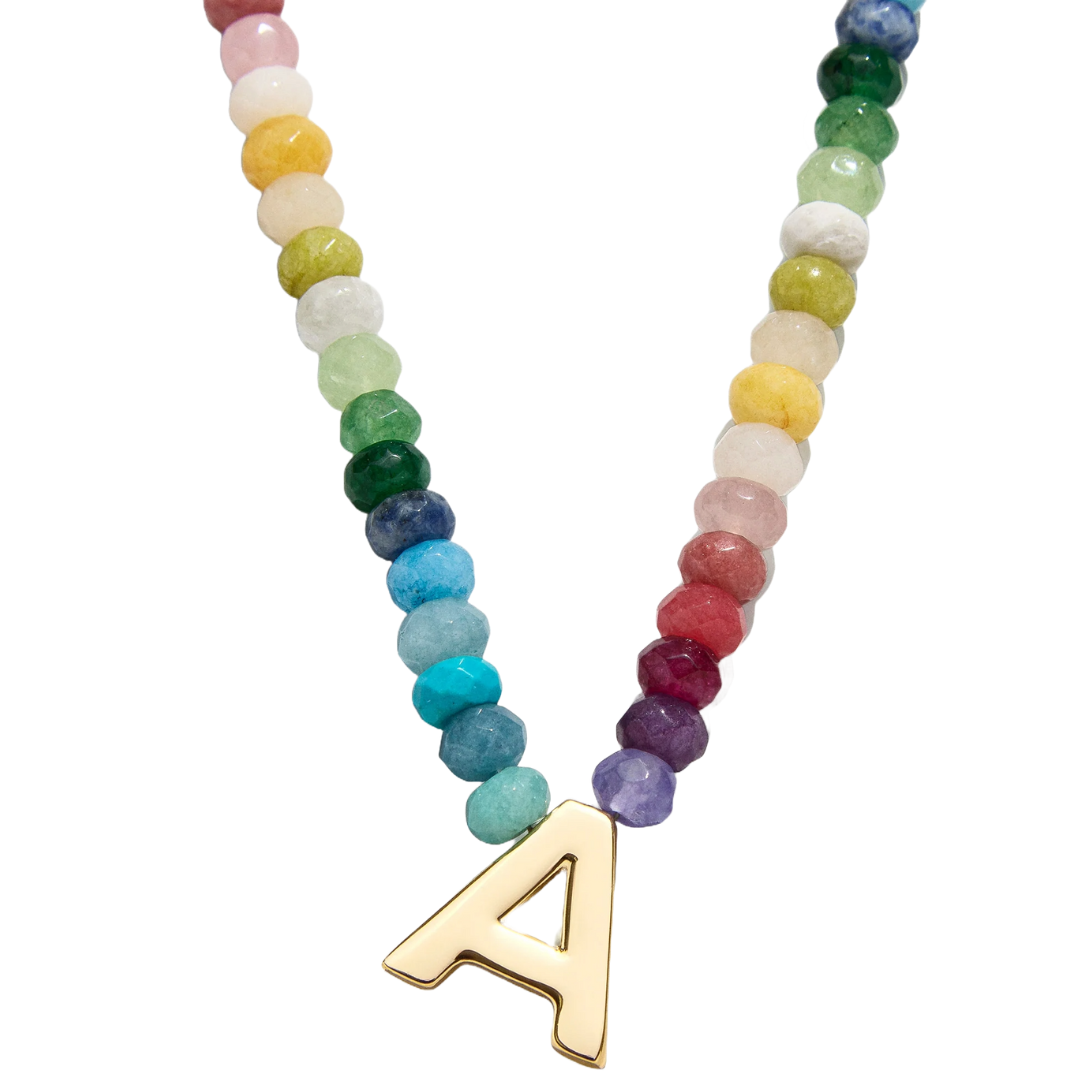 Colorful beaded necklace featuring a gold letter \“A\“ pendant.
