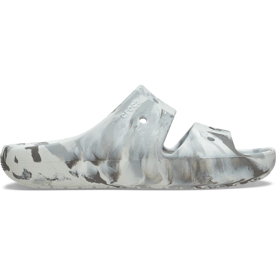 A pair of marbled gray and white slip-on sandals with a lightweight, molded design, featuring the Crocs logo and ventilation holes.